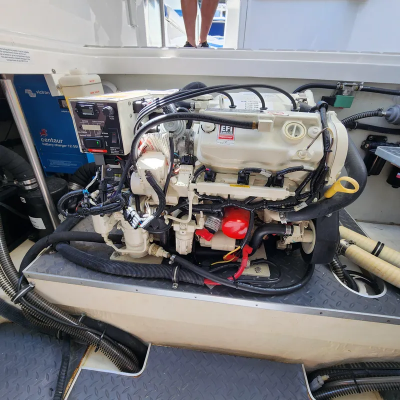 Slide: The Image of Engine compartment of a 2019 Formula 330 Crossover Bowrider OB boat. - 48