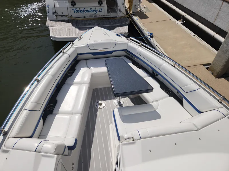 Slide: The Image of 2019 Formula 330 Crossover Bowrider OB with spacious seating and table in the bow area. - 5