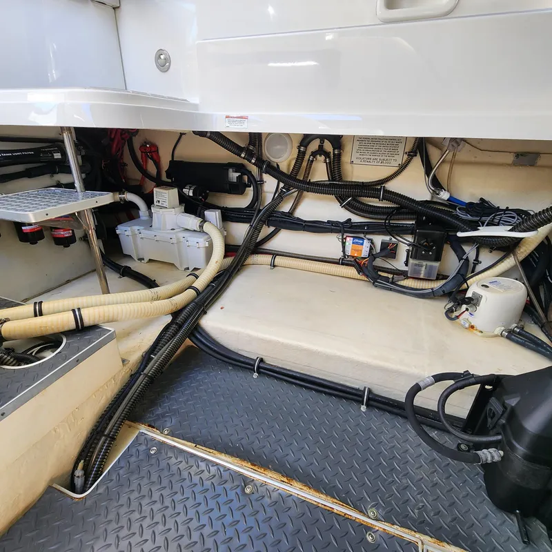 Slide: The Image of Engine compartment of 2019 Formula 330 Crossover Bowrider OB, showcasing wiring and components. - 50