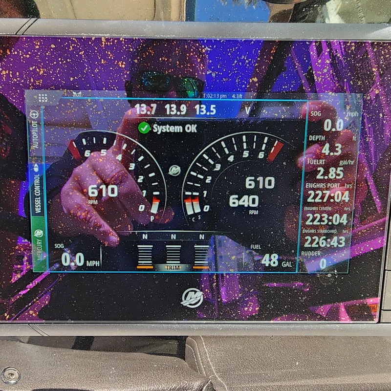Slide: The Image of Digital dashboard of a 2019 Formula 330 Crossover Bowrider OB boat displaying system status. - 53