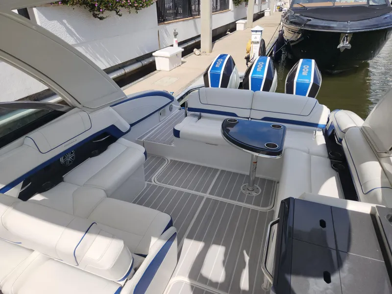 Slide: The Image of 2019 Formula 330 Crossover Bowrider OB with spacious seating and sleek design. - 6