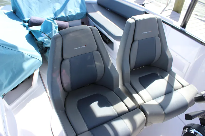 Slide: The Image of 2022 Axopar 22 T Top boat seats, featuring sleek gray upholstery and modern design. - 30