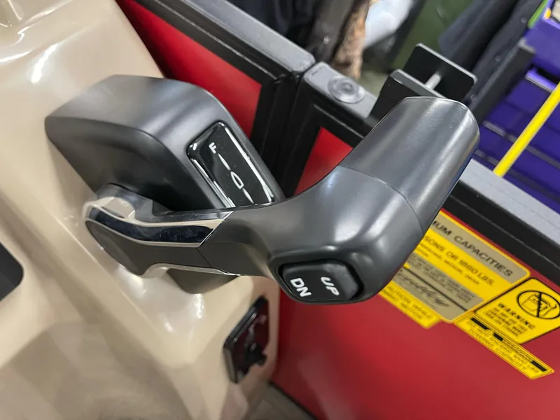 Slide: The Image of Close-up of 2025 Bentley Pontoons 200 Fish-N-Cruise throttle control lever. - 16