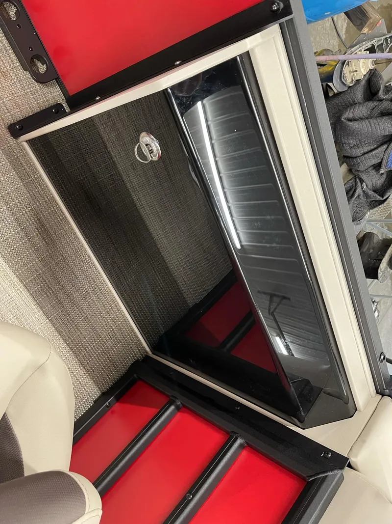 Slide: The Image of 2025 Bentley Pontoons 200 Fish-N-Cruise interior detail with red and black accents. - 19