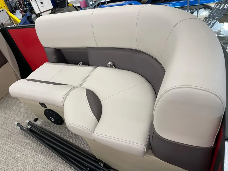 Slide: The Image of 2025 Bentley Pontoons 200 Fish-N-Cruise boat seating, beige and brown upholstery, luxurious design. - 23