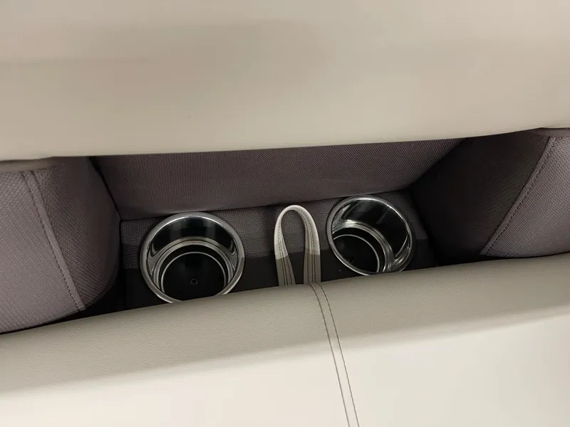Slide: The Image of 2025 Bentley Pontoons 200 Fish-N-Cruise cup holders in beige and gray seating. - 26