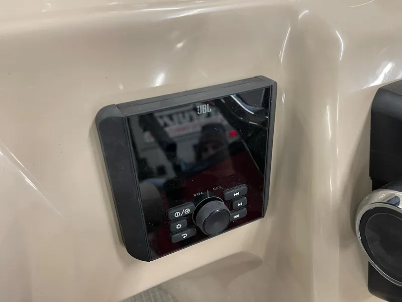 Slide: The Image of JBL audio control panel on 2025 Bentley Pontoons 200 Fish-N-Cruise boat dashboard. - 29