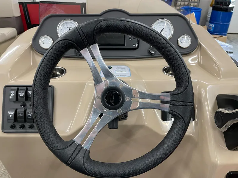 Slide: The Image of Steering wheel and dashboard of 2025 Bentley Pontoons 200 Fish-N-Cruise boat. - 31