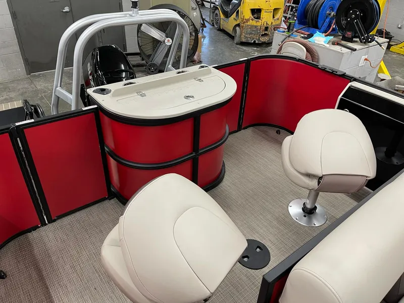 Slide: The Image of 2025 Bentley Pontoons 200 Fish-N-Cruise interior with red panels and beige seating. - 34