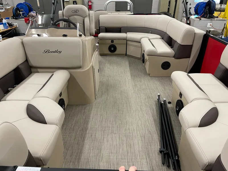 Slide: The Image of 2025 Bentley Pontoons 200 Fish-N-Cruise interior with beige seating and spacious layout. - 8