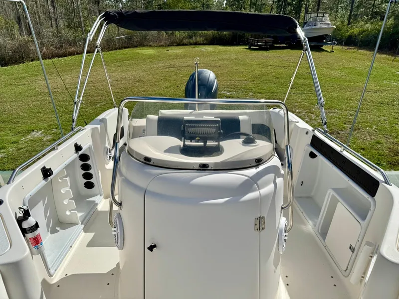 Slide: The Image of 2008 Hurricane FunDeck 211 O/B boat interior with steering console and canopy. - 10