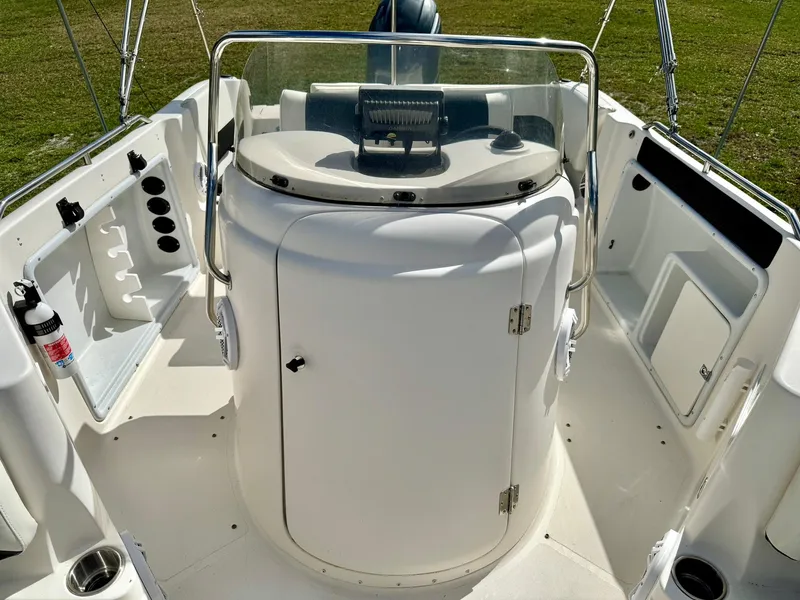Slide: The Image of 2008 Hurricane FunDeck 211 O/B boat interior with helm and seating area. - 11