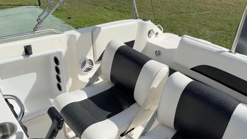 Slide: The Image of 2008 Hurricane FunDeck 211 O/B boat interior with black and white seating. - 17