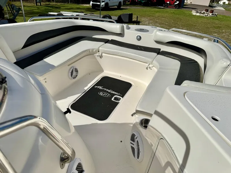 Slide: The Image of 2008 Hurricane FunDeck 211 O/B boat interior with seating and speakers. - 7