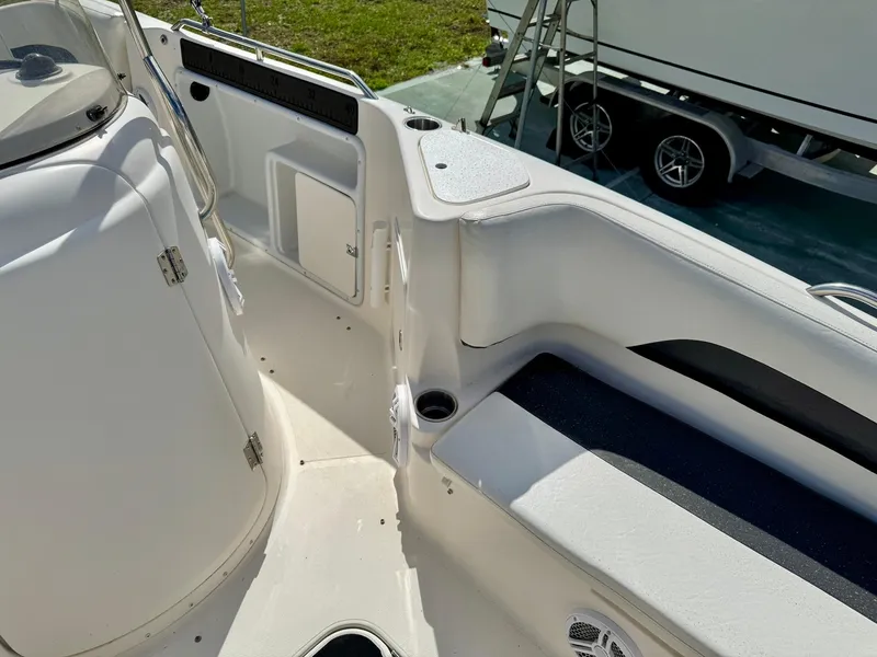 Slide: The Image of 2008 Hurricane FunDeck 211 O/B interior, featuring seating and storage compartments. - 8