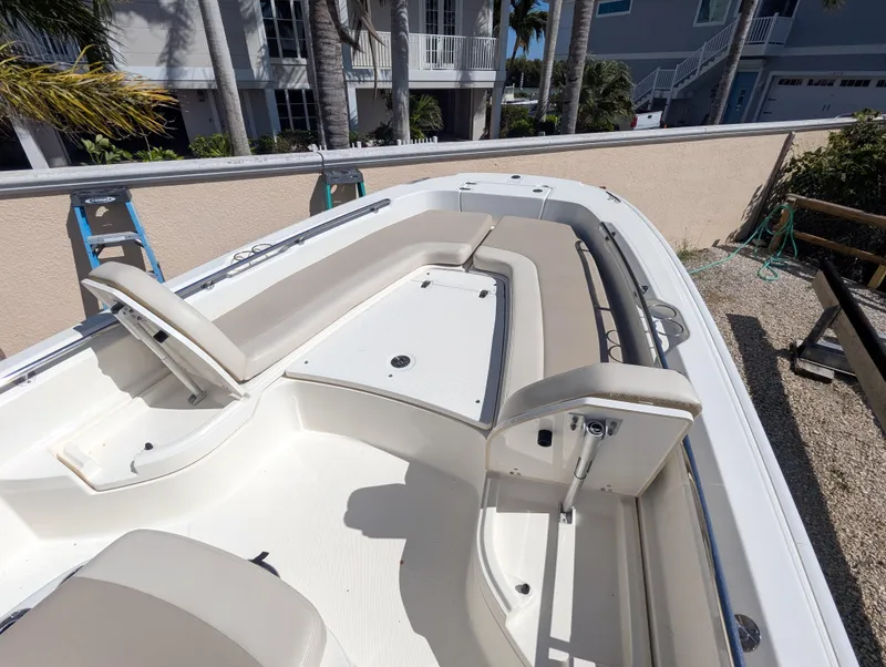 Slide: The Image of 2017 Boston Whaler 240 Dauntless boat with spacious seating and sleek design. - 13