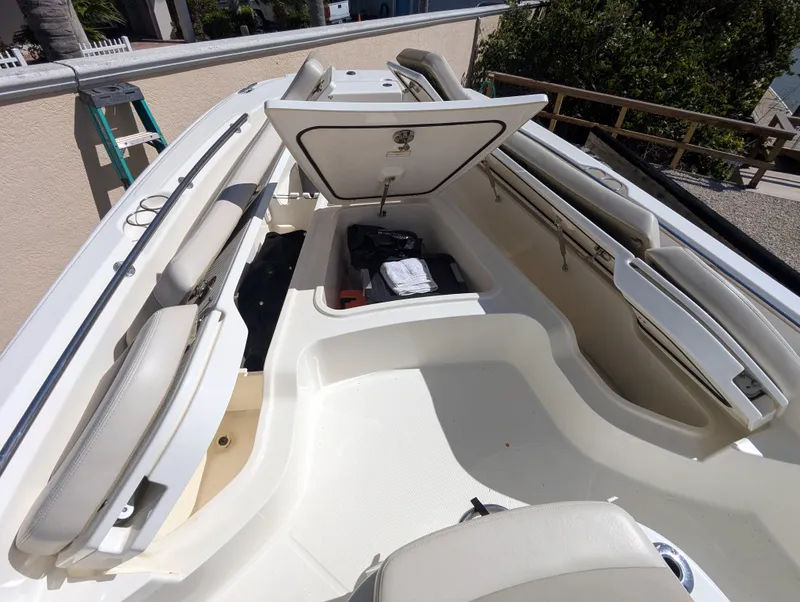 Slide: The Image of 2017 Boston Whaler 240 Dauntless boat interior with open storage compartment. - 15