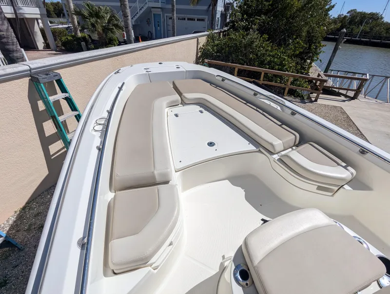 Slide: The Image of 2017 Boston Whaler 240 Dauntless boat with spacious seating and sleek design. - 16