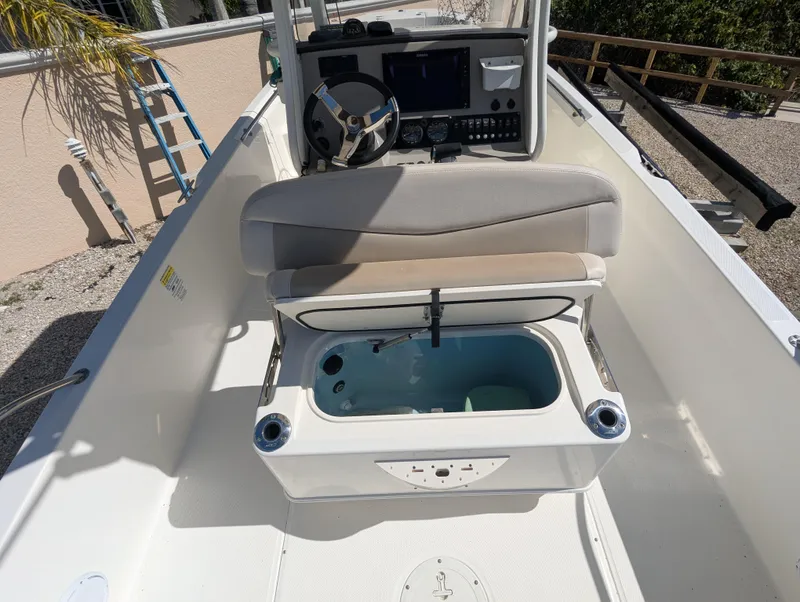 Slide: The Image of 2017 Boston Whaler 240 Dauntless boat interior with open storage compartment. - 19