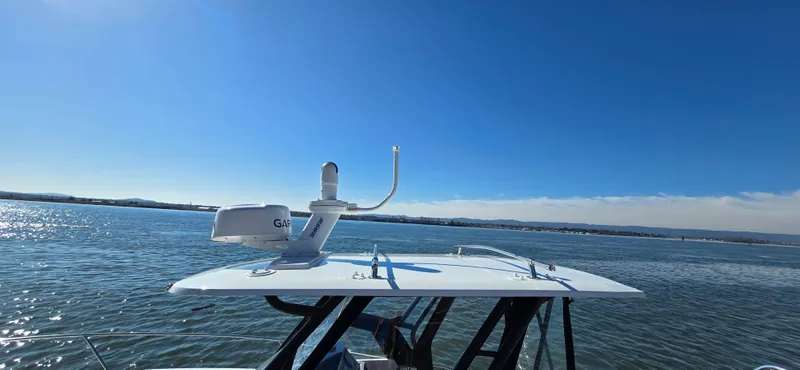 Slide: The Image of 2022 Leader 7.5 wa boat on water, clear sky, radar equipment visible. - 20