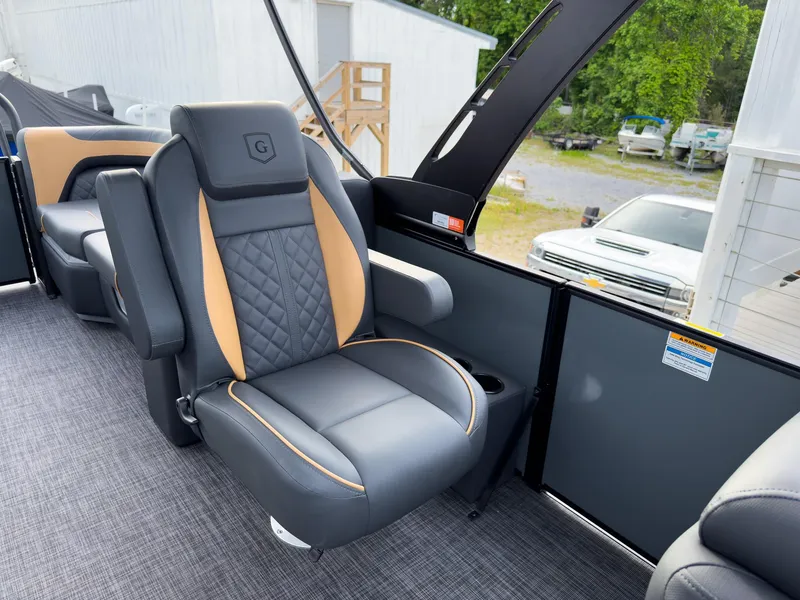 Slide: The Image of Luxurious seating on 2025 Godfrey Sweetwater 22' Split Bench Tritoon boat, featuring modern design. - 11