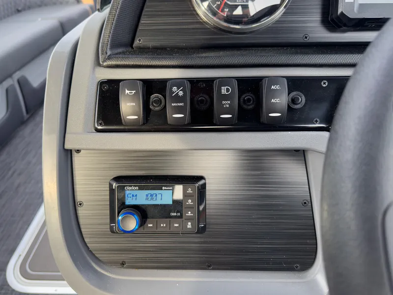 Slide: The Image of Control panel of 2025 Godfrey Sweetwater 22' Tritoon with radio and switches. - 15