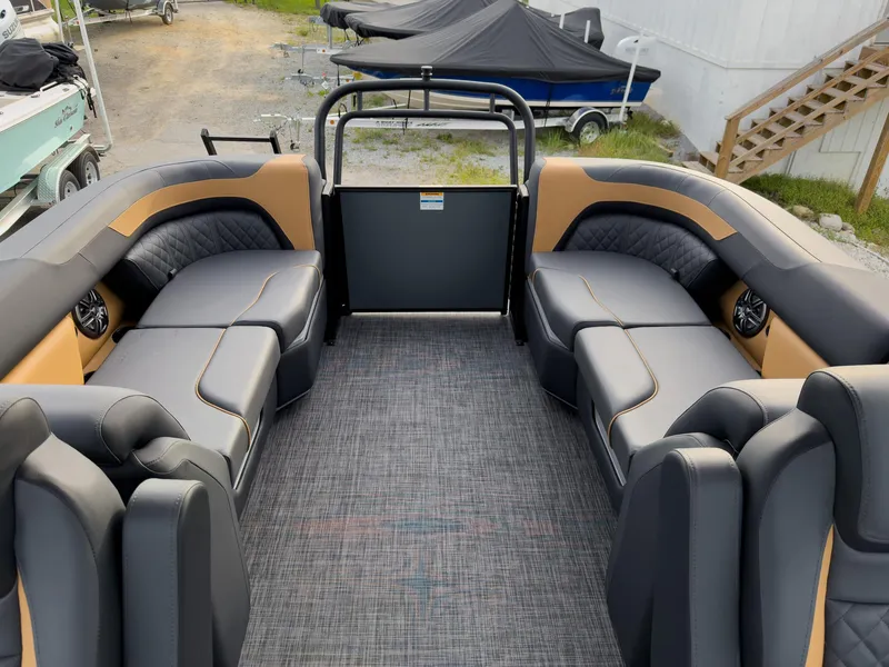 Slide: The Image of 2025 Godfrey Sweetwater 22' Tritoon interior with split bench seating and modern design. - 19