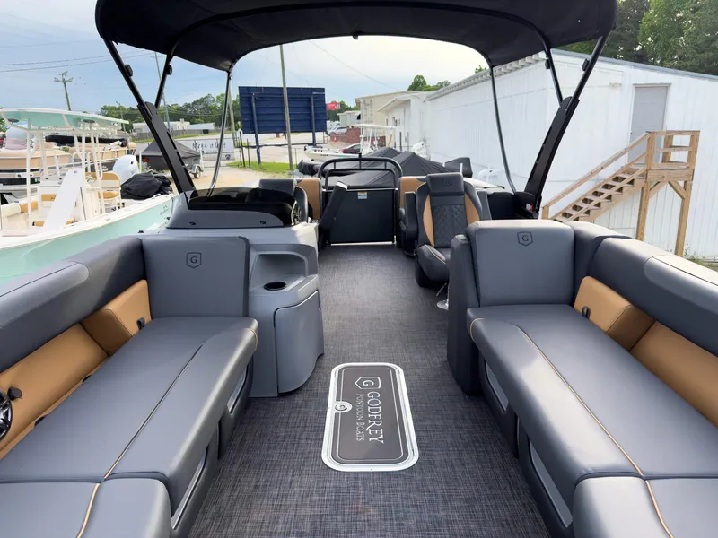 Slide: The Image of 2025 Godfrey Sweetwater 22' Split Bench Tritoon with spacious seating and modern design. - 7
