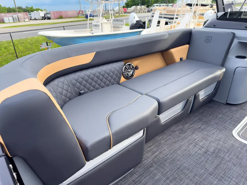 Slide: The Image of 2025 Godfrey Sweetwater 22' Tritoon interior with stylish split bench seating. - 9