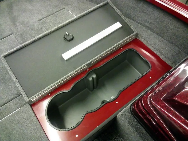 Slide: The Image of 2025 Ranger VS1665 SC storage compartment with open lid, showcasing interior design. - 12