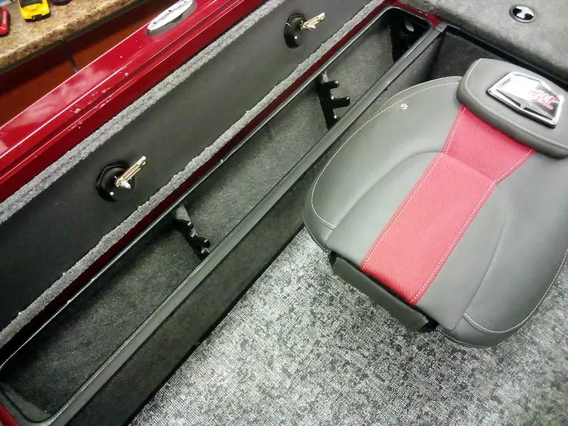 Slide: The Image of 2025 Ranger VS1665 SC boat interior with red and gray seating and storage compartments. - 18