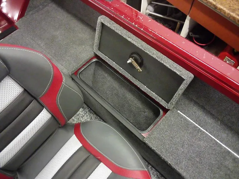 Slide: The Image of Interior of 2025 Ranger VS1665 SC boat with storage compartment and stylish seating. - 19