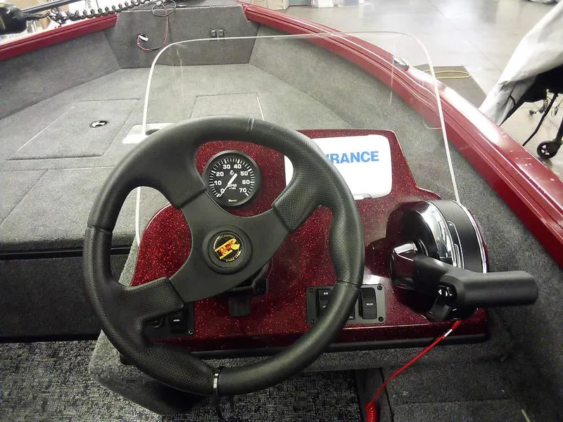 Slide: The Image of 2025 Ranger VS1665 SC boat dashboard with steering wheel and control panel. - 22