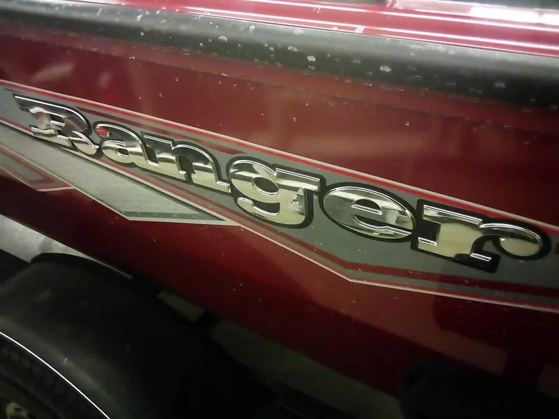 Slide: The Image of 2025 Ranger VS1665 SC boat with red and silver detailing. - 9