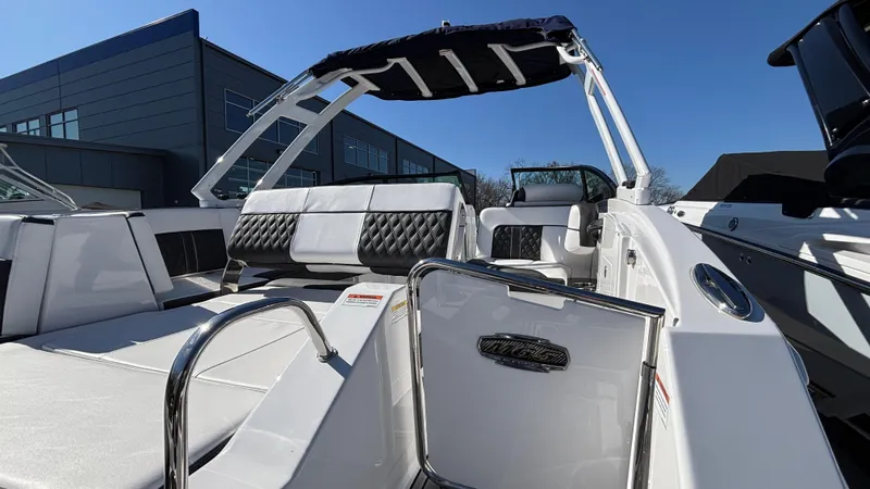 Slide: The Image of 2025 Monterey M65 boat interior with white seating and sleek design. - 20