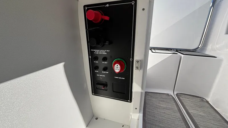 Slide: The Image of Control panel inside 2025 Monterey M65 boat, featuring switches and safety controls. - 22