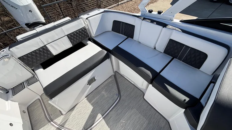 Slide: The Image of 2025 Monterey M65 boat interior with stylish black and white seating. - 24