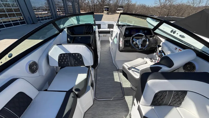 Slide: The Image of 2025 Monterey M65 boat interior with modern seating and sleek dashboard design. - 27