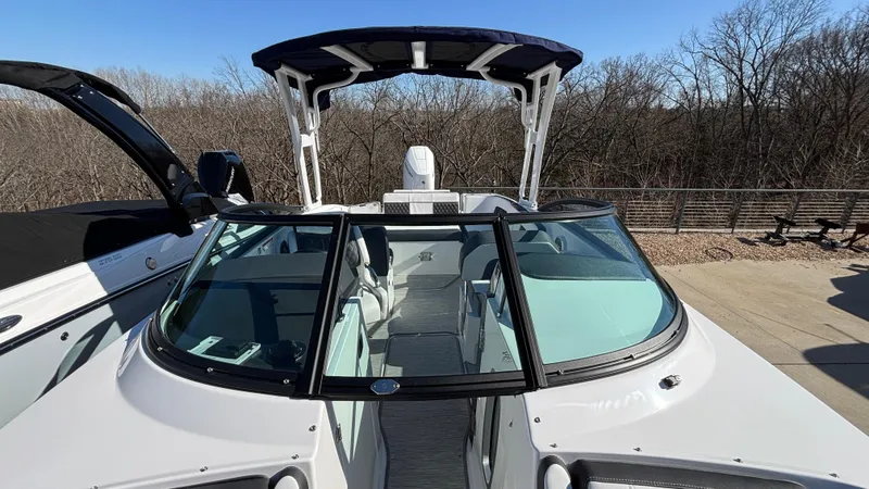 Slide: The Image of 2025 Monterey M65 boat with sleek design, glass windshield, and spacious interior. - 29