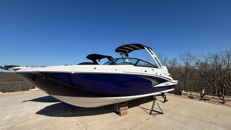 Slide: The Image of 2025 Monterey M65 boat on a concrete surface under clear blue sky. - 3