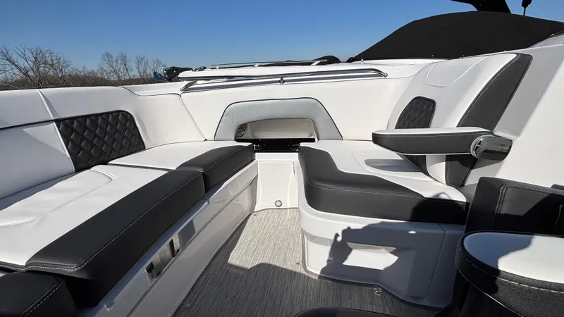 Slide: The Image of Luxurious seating on 2025 Monterey M65 boat, featuring sleek black and white upholstery. - 32