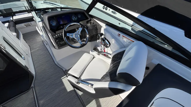 Slide: The Image of Interior of 2025 Monterey M65 boat with modern steering and controls. - 38