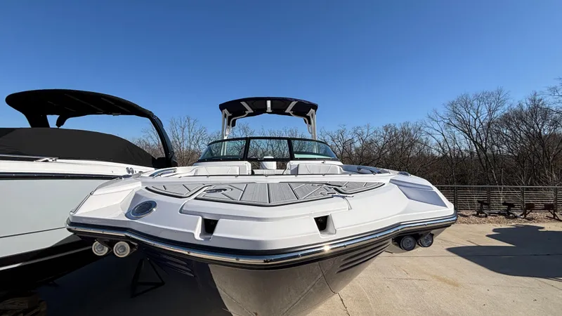 Slide: The Image of 2025 Monterey M65 boat with sleek design, docked under clear blue sky. - 5