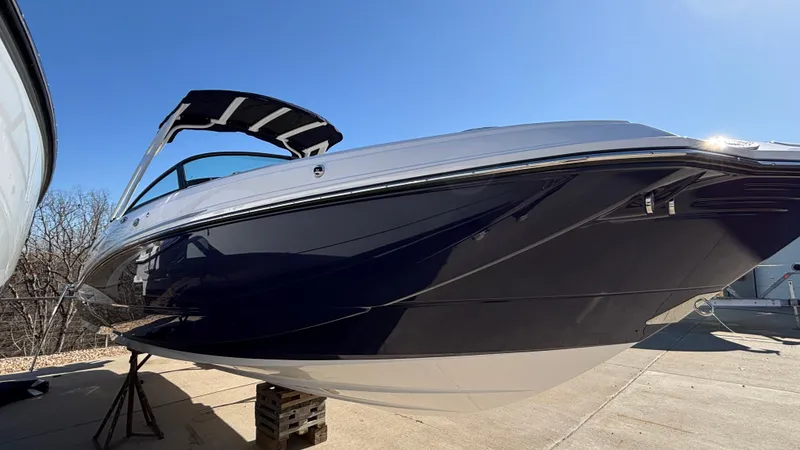 Slide: The Image of 2025 Monterey M65 boat with sleek design on display outdoors. - 6