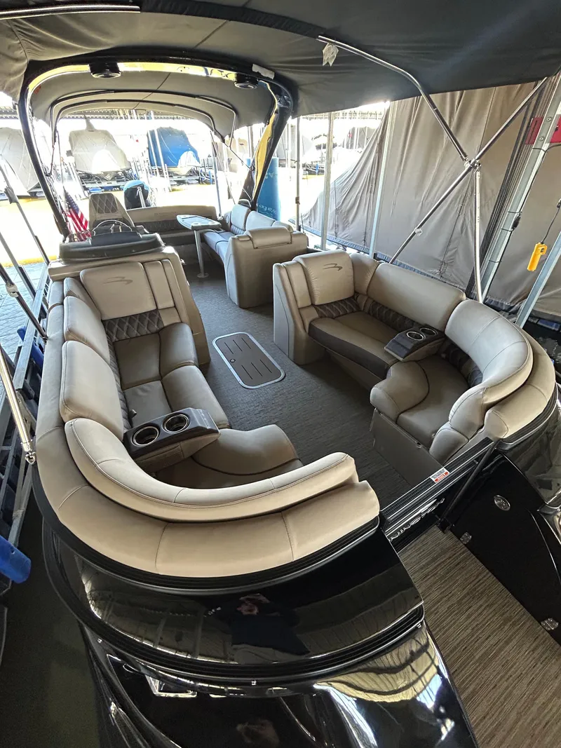 Slide: The Image of 2023 Bennington 25 QSBA pontoon boat with luxurious seating and canopy. - 3