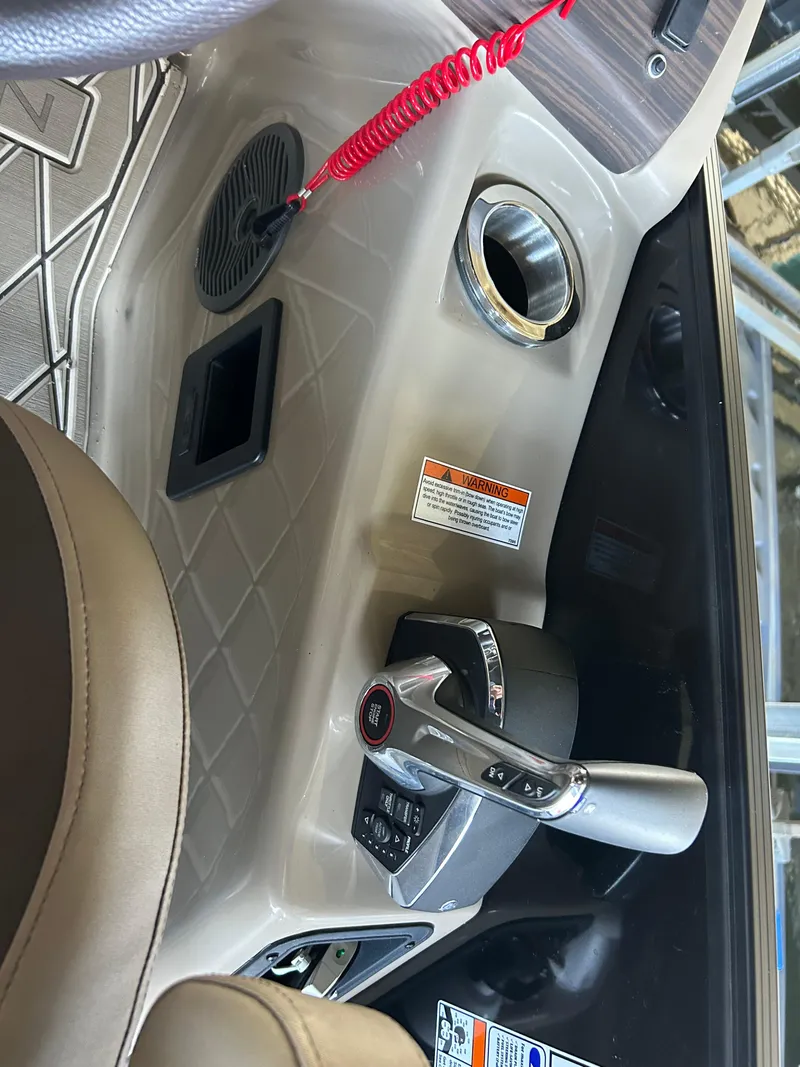 Slide: The Image of 2023 Bennington 25 QSBA boat interior with control panel and steering wheel. - 8