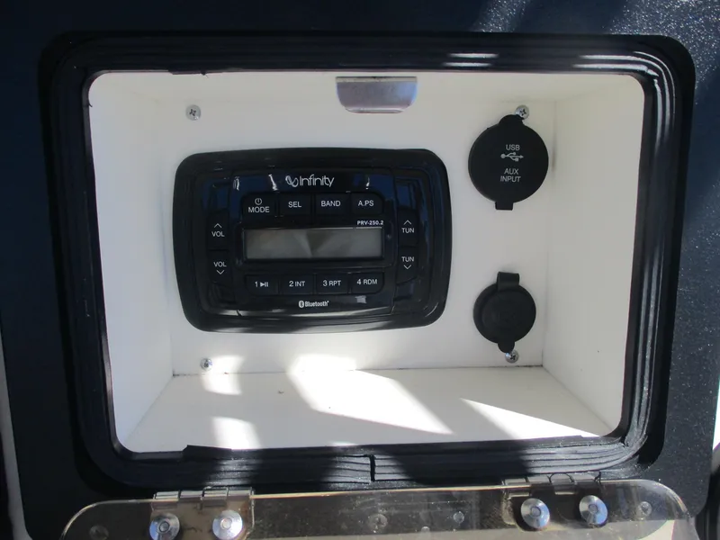 Slide: The Image of 2018 NauticStar 2400 Sport boat stereo system with USB and AUX inputs. - 12
