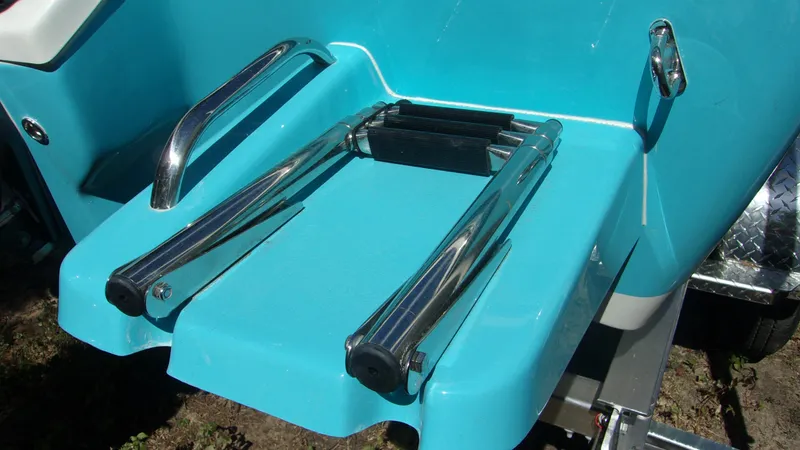 Slide: The Image of 2025 Key West 210 Bay Reef boat ladder, turquoise finish, stainless steel handles. - 11