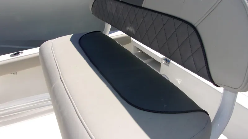 Slide: The Image of 2025 Key West 210 Bay Reef boat seat with cushioned backrest and sleek design. - 15