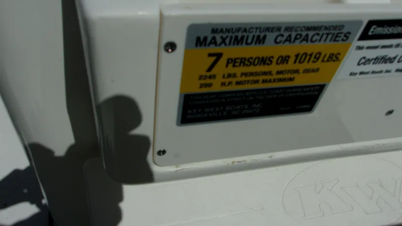Slide: The Image of 2025 Key West 210 Bay Reef capacity label, maximum 7 persons or 1019 lbs. - 16